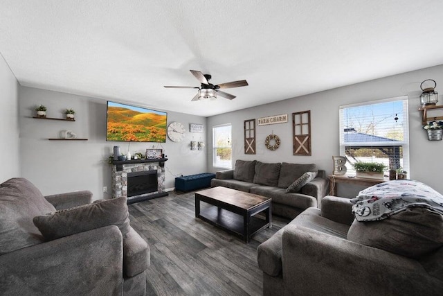 5582 Freedom Run, Orient, OH 43146 - living area with dark wood-type flooring, ceiling fan, and a fireplace