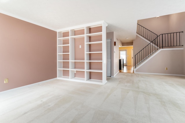 5613 Chowning Way, Columbus, OH 43213 - unfurnished living room featuring stairway and light colored carpet