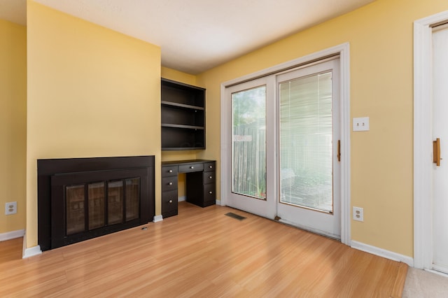 5613 Chowning Way, Columbus, OH 43213 - unfurnished living room with wood finished floors and a glass covered fireplace