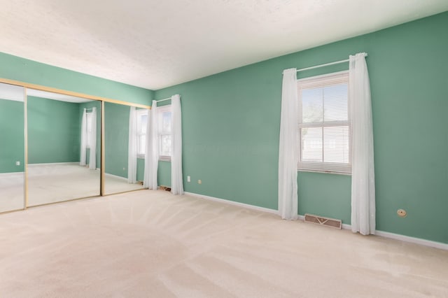 5613 Chowning Way, Columbus, OH 43213 - unfurnished bedroom with multiple windows and carpet flooring