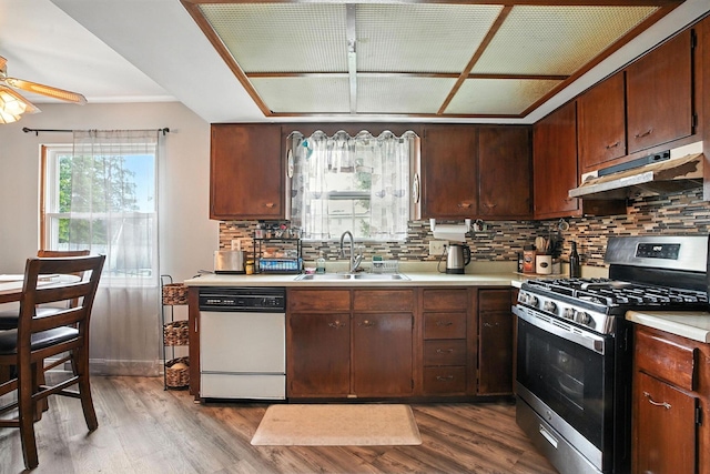 5328 Torchwood Loop E, Columbus, OH 43229 - kitchen with stainless steel range with gas cooktop, dishwasher, under cabinet range hood, light countertops, and wood finished floors