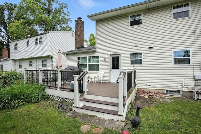 5328 Torchwood Loop E, Columbus, OH 43229 - back of property featuring a wooden deck, a chimney, and a yard