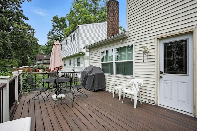 5328 Torchwood Loop E, Columbus, OH 43229 - wooden terrace with outdoor dining space and a grill