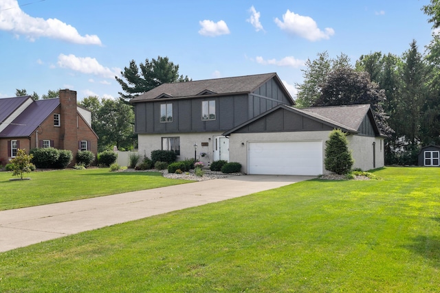 1242 Springbrook Dr, Mansfield, OH 44906 - view of front of home featuring board and batten siding, an attached garage, a front yard, and driveway