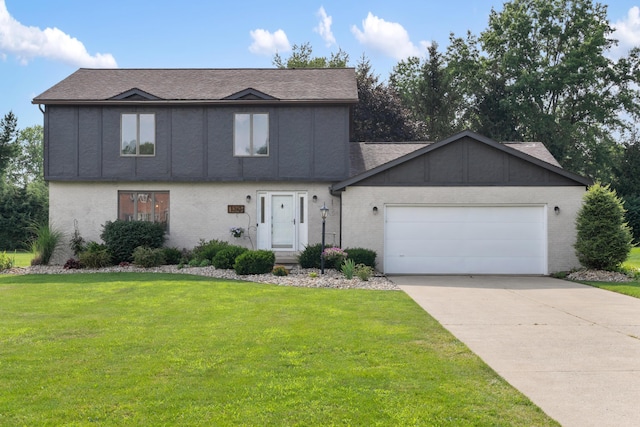 1242 Springbrook Dr, Mansfield, OH 44906 - view of front of property with an attached garage, a front lawn, brick siding, concrete driveway, and a shingled roof