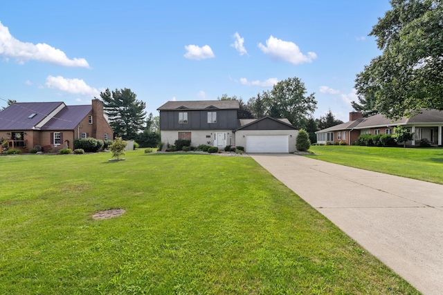 1242 Springbrook Dr, Mansfield, OH 44906 - dutch colonial featuring concrete driveway, a front lawn, and a garage