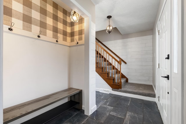 1242 Springbrook Dr, Mansfield, OH 44906 - mudroom featuring stone tile flooring and a textured ceiling