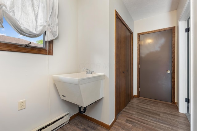 1242 Springbrook Dr, Mansfield, OH 44906 - bathroom featuring baseboard heating and wood finished floors