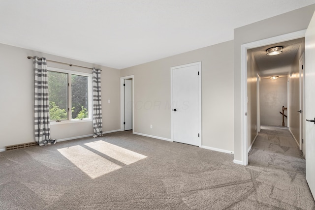 1242 Springbrook Dr, Mansfield, OH 44906 - unfurnished bedroom featuring carpet flooring and baseboards