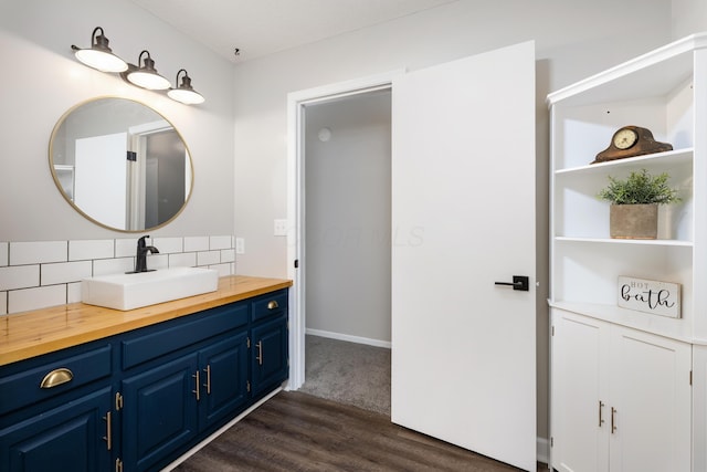 1242 Springbrook Dr, Mansfield, OH 44906 - bathroom with backsplash, vanity, and wood finished floors