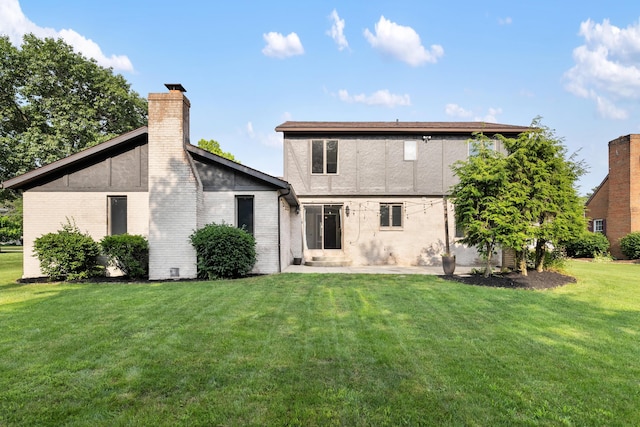 1242 Springbrook Dr, Mansfield, OH 44906 - rear view of house with brick siding, a lawn, a chimney, and a patio