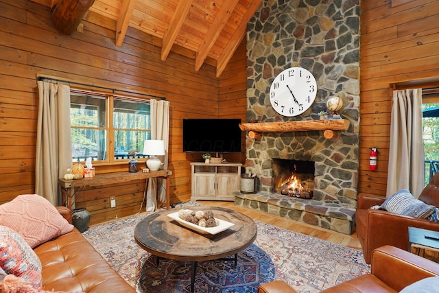 16651 Skinner Rd, Logan, OH 43138 - living area featuring wood finished floors, a wood ceiling with exposed beams, wooden walls, high vaulted ceiling, and a fireplace