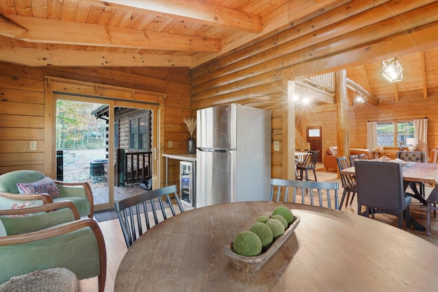 16651 Skinner Rd, Logan, OH 43138 - dining space featuring wood finished floors, wood ceiling, wood walls, and wine cooler