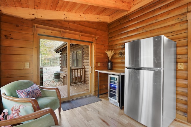 16651 Skinner Rd, Logan, OH 43138 - kitchen featuring freestanding refrigerator, wine cooler, light wood-type flooring, log walls, and a wood ceiling with exposed beams