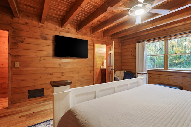 16651 Skinner Rd, Logan, OH 43138 - bedroom with a wood ceiling with exposed beams, wood walls, and a ceiling fan