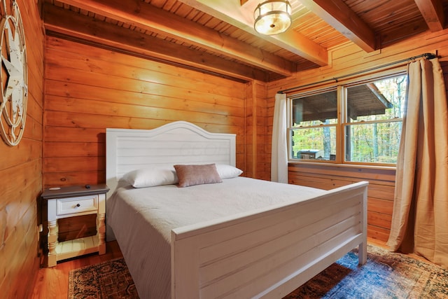 16651 Skinner Rd, Logan, OH 43138 - bedroom featuring a wooden ceiling with exposed beams, wooden walls, and wood finished floors
