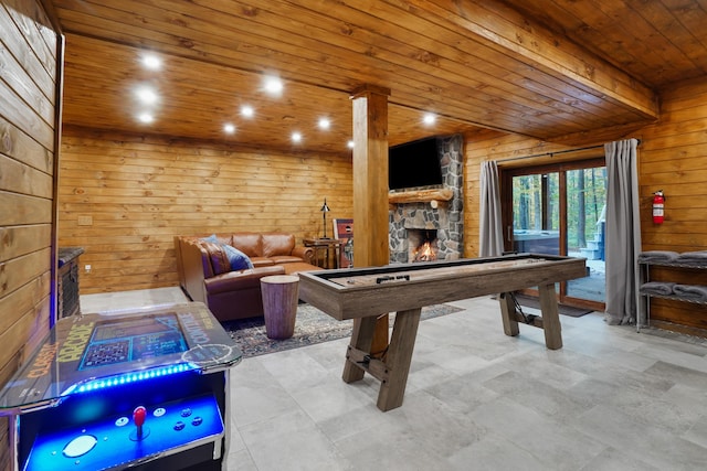 16651 Skinner Rd, Logan, OH 43138 - game room with a stone fireplace, wood ceiling, and wooden walls