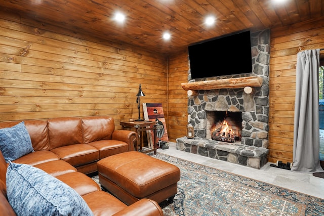 16651 Skinner Rd, Logan, OH 43138 - living room with wooden ceiling, wooden walls, a stone fireplace, concrete floors, and recessed lighting