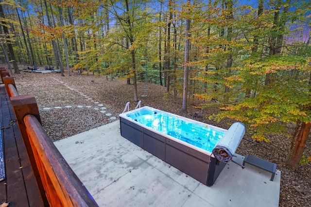 16651 Skinner Rd, Logan, OH 43138 - view of patio with a hot tub and a forest view