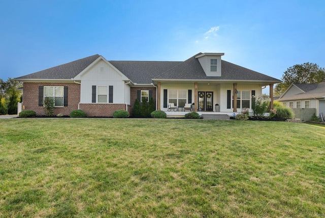 4881 Hoover Rd, Grove City, OH 43123 - view of front facade featuring a front lawn, brick siding, board and batten siding, and a patio