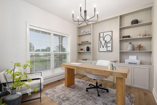 4881 Hoover Rd, Grove City, OH 43123 - office space with a chandelier, built in features, and light wood finished floors