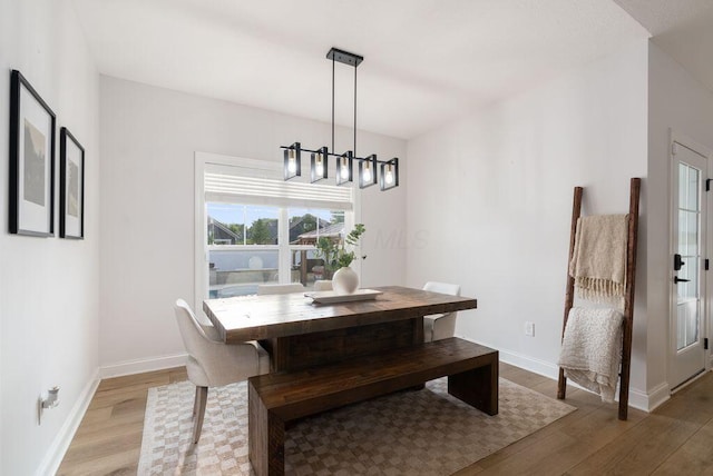 4881 Hoover Rd, Grove City, OH 43123 - dining area with wood finished floors and a chandelier