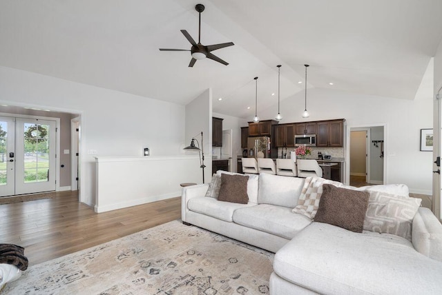 4881 Hoover Rd, Grove City, OH 43123 - living area featuring ceiling fan, light wood-style flooring, high vaulted ceiling, french doors, and beam ceiling