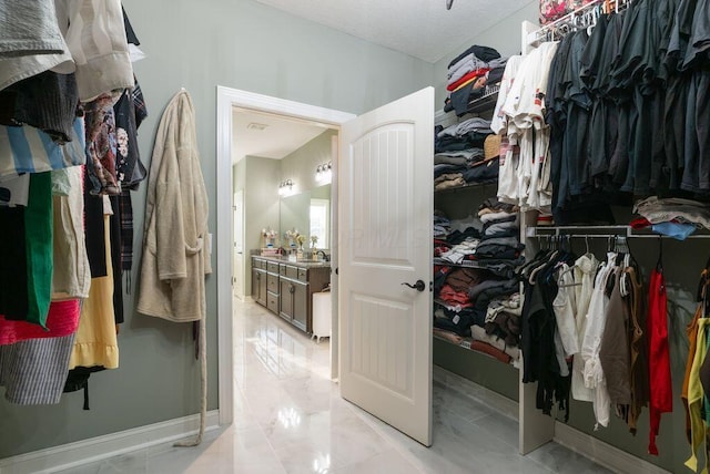 4881 Hoover Rd, Grove City, OH 43123 - walk in closet featuring marble finish floors