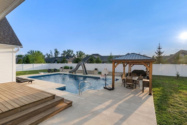 4881 Hoover Rd, Grove City, OH 43123 - view of swimming pool featuring a water slide, a gazebo, a fenced backyard, and a patio area