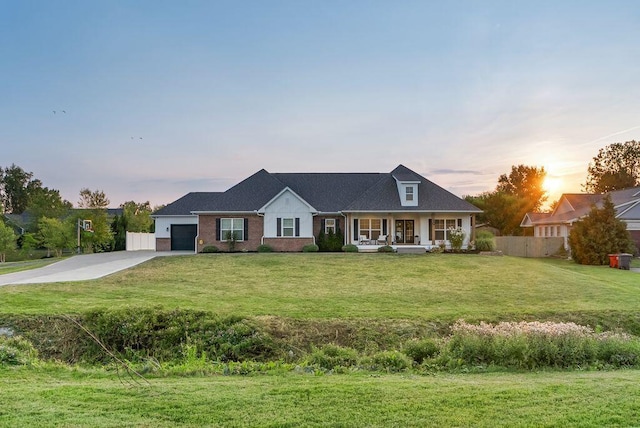 4881 Hoover Rd, Grove City, OH 43123 - view of front facade with a porch, concrete driveway, and a garage