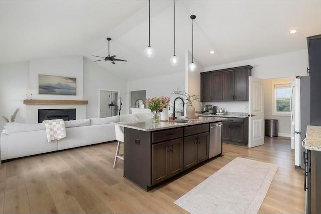 4881 Hoover Rd, Grove City, OH 43123 - kitchen with dishwasher, dark brown cabinetry, a ceiling fan, open floor plan, and high vaulted ceiling