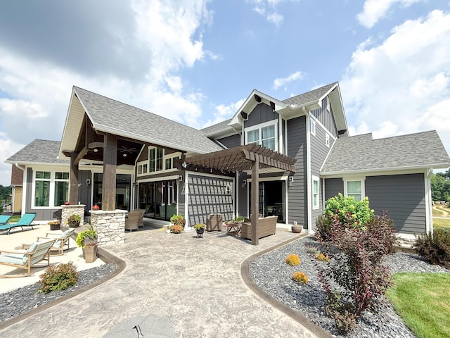 5470 Maple Glen Dr, Galena, OH 43021 - view of front facade with a pergola, a patio, board and batten siding, an outdoor hangout area, and a shingled roof
