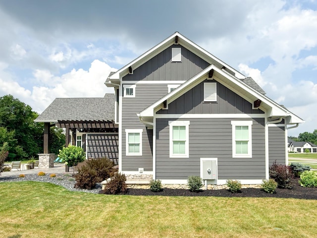5470 Maple Glen Dr, Galena, OH 43021 - back of property featuring a lawn, board and batten siding, a pergola, and a patio area