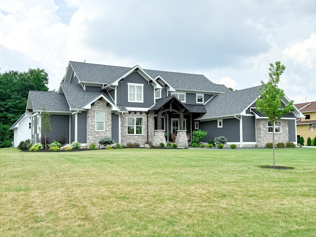 5470 Maple Glen Dr, Galena, OH 43021 - craftsman inspired home featuring board and batten siding, a front lawn, stone siding, and roof with shingles
