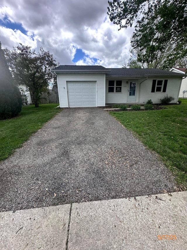 103 Andrew Ct E, London, OH 43140 - ranch-style house featuring driveway, an attached garage, and a front lawn