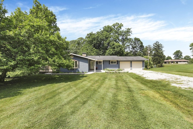 1725 Graham Dr NE, Lancaster, OH 43130 - ranch-style home with an attached garage, driveway, a front lawn, and a chimney