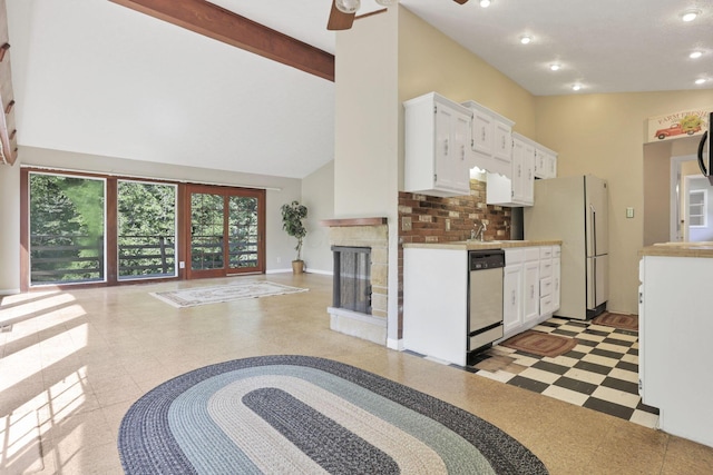 1725 Graham Dr NE, Lancaster, OH 43130 - kitchen featuring high vaulted ceiling, freestanding refrigerator, white cabinetry, dishwashing machine, and light countertops