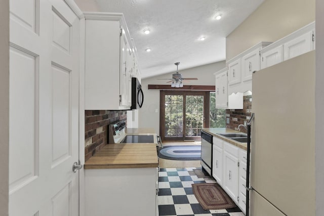 1725 Graham Dr NE, Lancaster, OH 43130 - kitchen with freestanding refrigerator, dark floors, stainless steel dishwasher, black microwave, and decorative backsplash