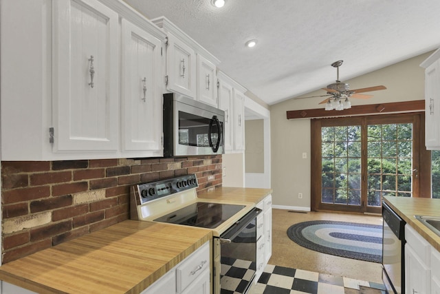 1725 Graham Dr NE, Lancaster, OH 43130 - kitchen with stainless steel appliances, butcher block countertops, a ceiling fan, white cabinetry, and vaulted ceiling