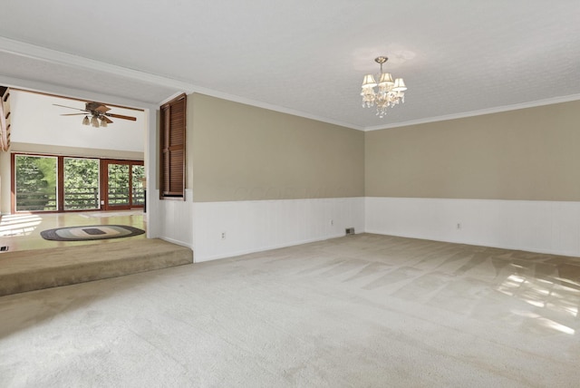 1725 Graham Dr NE, Lancaster, OH 43130 - empty room featuring carpet flooring, a chandelier, wainscoting, a ceiling fan, and crown molding