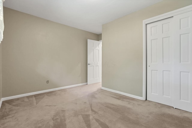 1725 Graham Dr NE, Lancaster, OH 43130 - unfurnished bedroom featuring carpet flooring and a closet