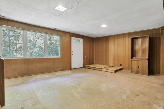 1725 Graham Dr NE, Lancaster, OH 43130 - unfurnished room with concrete flooring and wooden walls