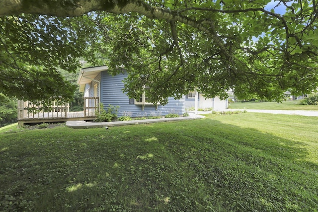 1725 Graham Dr NE, Lancaster, OH 43130 - view of home's exterior with a lawn and a deck