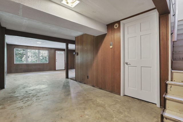 1725 Graham Dr NE, Lancaster, OH 43130 - hall featuring concrete flooring and wood walls