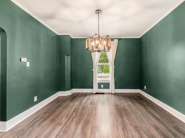 366 S Richardson Ave, Columbus, OH 43204 - empty room featuring a chandelier, arched walkways, wood finished floors, and ornamental molding