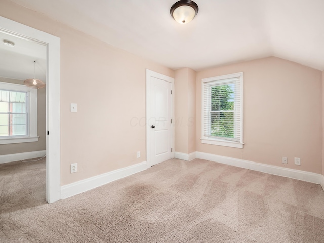 366 S Richardson Ave, Columbus, OH 43204 - unfurnished bedroom with carpet floors, multiple windows, and lofted ceiling
