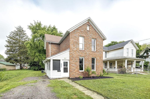 211 Buckingham St, Newark, OH 43055 - traditional-style home featuring brick siding, a front yard, and a porch