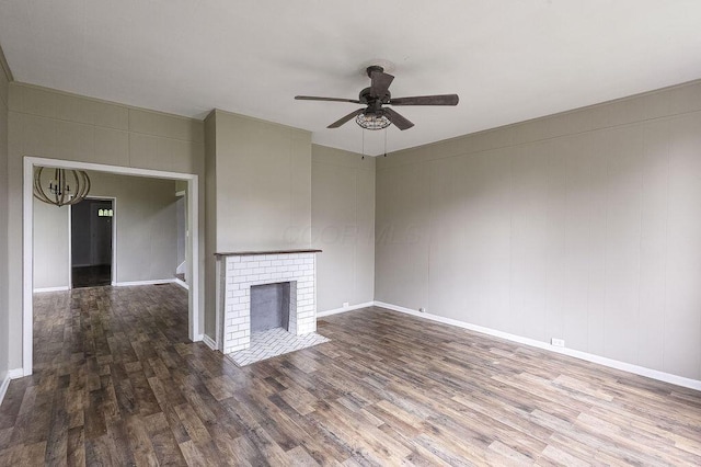 211 Buckingham St, Newark, OH 43055 - unfurnished living room with wood finished floors, a ceiling fan, and a fireplace