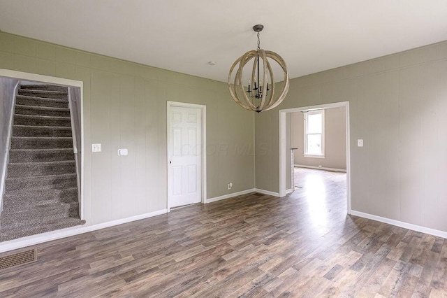 211 Buckingham St, Newark, OH 43055 - empty room featuring a chandelier, wood finished floors, and stairs