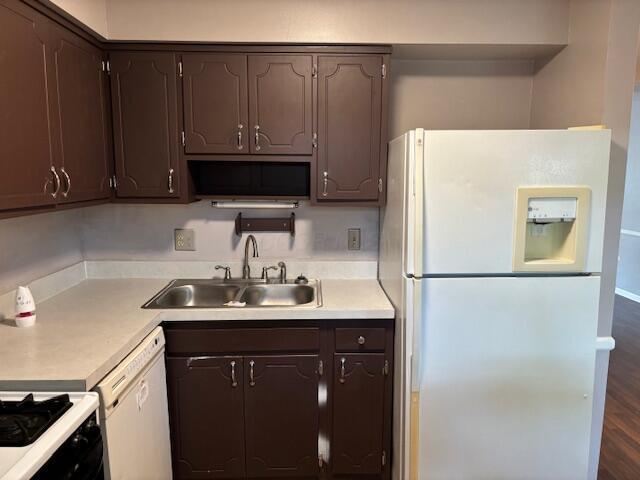 2382 Hardesty Dr S Unit Q5, Columbus, OH 43204 - kitchen with white appliances, dark brown cabinets, light countertops, and dark wood-style floors